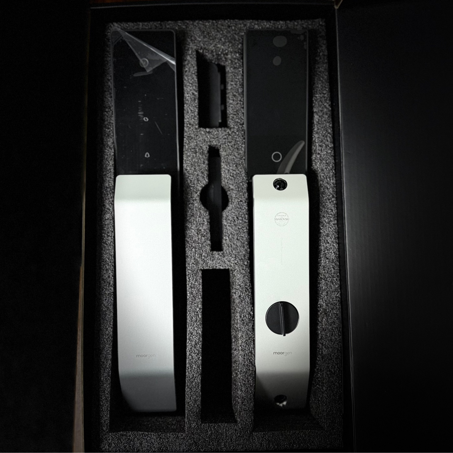 Set of electronic door locks in a black box with a dark background